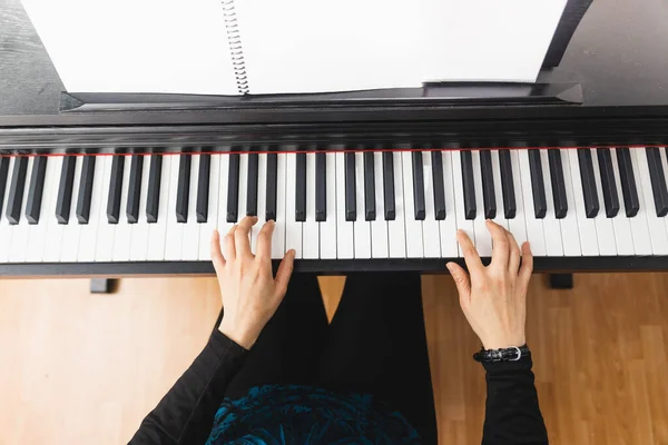 Top View Womans Hands Playing Piano Reading Sheet Music High — Fotografia de Stock