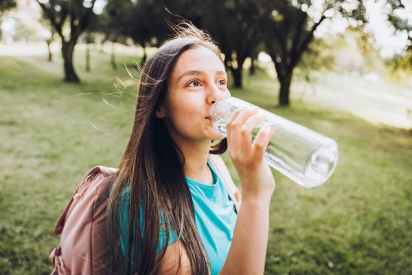 Caucasian Young Lady Wearing Turquoise Shirt Pink Backpack Drinking Water — Stock Photo, Image