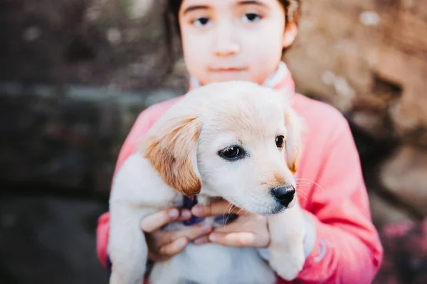 Little Girl Embracing Golden Retriever Puppy Park High Quality Photo — Fotografia de Stock