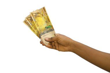 Beyaz arka planda izole edilmiş 3 boyutlu Ugandalı şilin banknotlar.