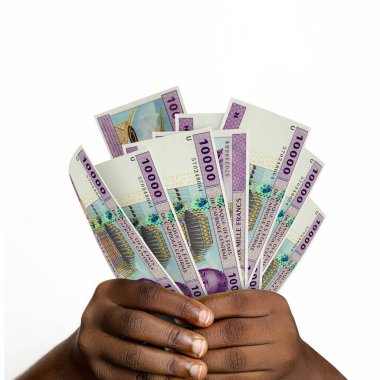 Black hands holding 3D rendered 10000 Central African CFA franc notes. closeup of Hands holding Cfa currency notes. Cameroonian, Central African Republic, Chadian, Republic of the Congo, Congolese