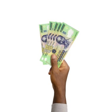 Black Hand holding 3D rendered 500000 Vietnamese Dong notes isolated on white background