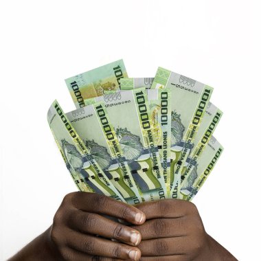 Black hands holding 3D rendered Sierra Leonean leone notes. closeup of Hands holding Sierra Leonean currency notes