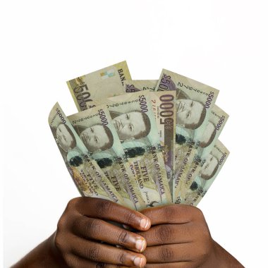 Black hands holding 3D rendered 5000 Jamaican dollar notes. closeup of Hands holding Jamaican currency notes