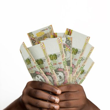 Black hands holding 3D rendered Peruvian sol notes. closeup of Hands holding Peruvian currency notes