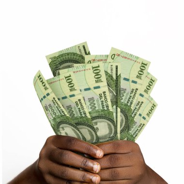 Black hands holding 3D rendered 100000 Paraguayan guarani notes. closeup of Hands holding Paraguayan currency notes