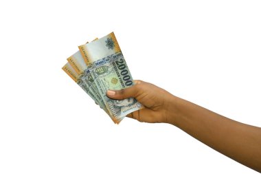 Fair hand holding 3D rendered 20000 Hungarian forint notes isolated on white background