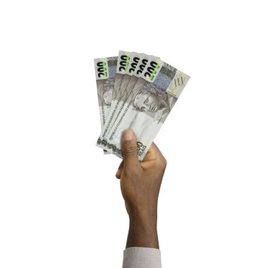 Black Hand holding 3D rendered 200 Brazilian reais notes isolated on white background. Brazilian real notes