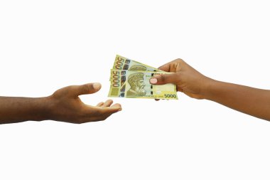 Hand giving 3D rendered 5000 Albanian lek notes to another hand. Hand receiving money