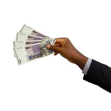 Black Hand with suit holding 3D rendered 1000 Croatian Kuna notes isolated on white background