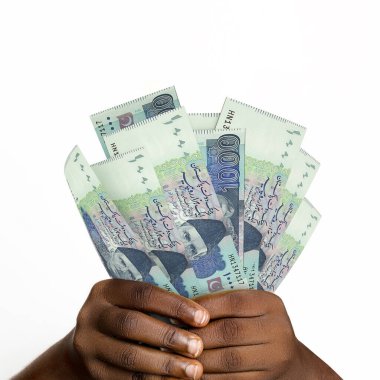 Black hands holding 3D rendered 1000 Pakistani Rupee notes. closeup of Hands holding Pakistani currency notes