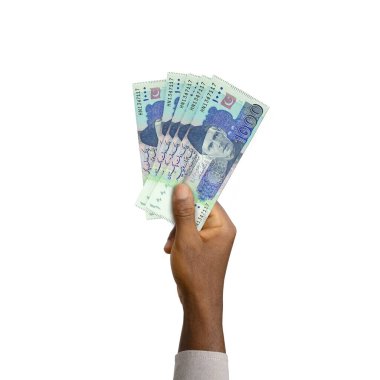 Black Hand holding 3D rendered Pakistani rupee notes isolated on white background