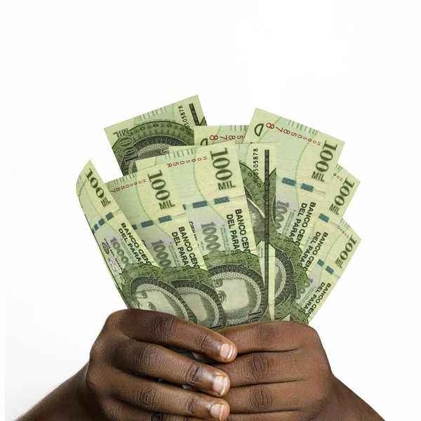 Black hands holding 3D rendered 100000 Paraguayan guarani notes. closeup of Hands holding Paraguayan currency notes
