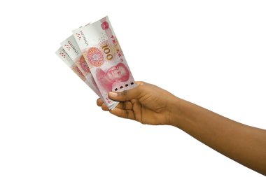 Fair hand holding 3D rendered Chinese Yuan notes isolated on white background