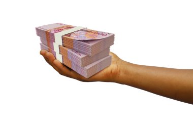 Hand Holding 3D rendered stack of CFA Franc notes isolated on white background