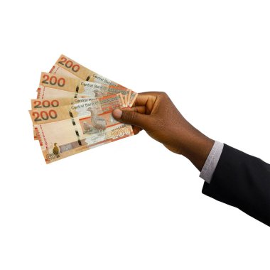 Black hand with suit holding 3D rendered Gambian Dalasi notes isolated on white background