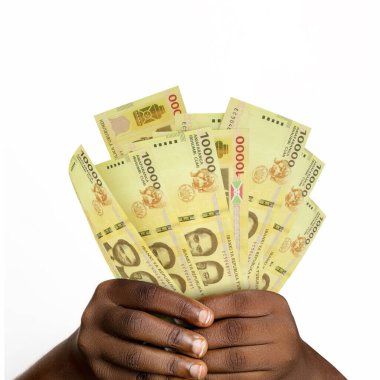 hands holding 3D rendered 10000 Burundian franc notes. closeup of Hands holding Burundian currency notes