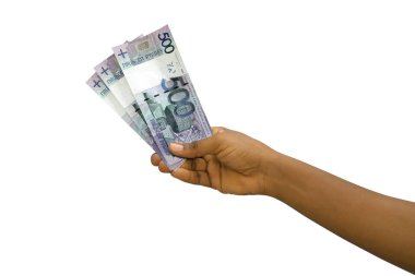 Fair hand holding 3D rendered Belarusian ruble notes isolated on white background