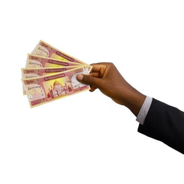  Hand holding 3D rendering of 10000 Afghan afghani notes