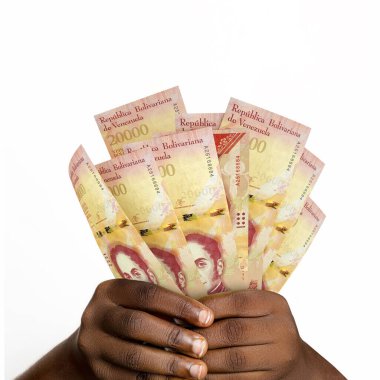 Black hands holding 3D rendered 20000 Venezuelan Bolvares notes. closeup of Hands holding Venezuelan currency notes
