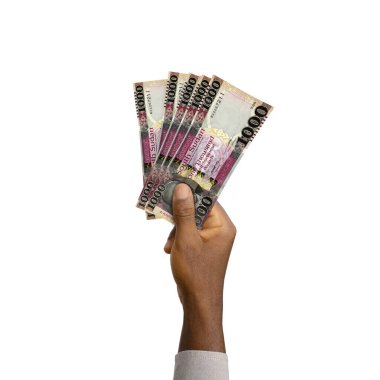 Black Hand holding 3D rendered South Sudanese Pound notes