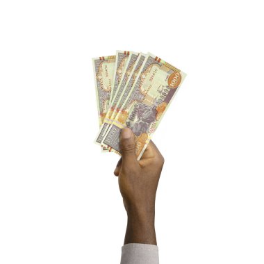 Black Hand holding 3D rendered Somalian shilling notes