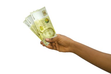 Fair hand holding 3D rendered Singapore dollar notes isolated on white background