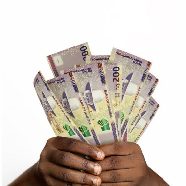 Black hands holding 3D rendered 200 Namibian dollar notes. closeup of Hands holding Namibian currency notes