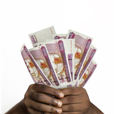 Black hands holding 3D rendered 5000 Myanmar kyat notes. closeup of Hands holding Myanmar currency notes
