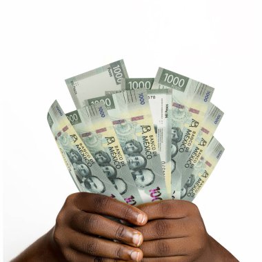 Black hands holding 3D rendered Mexican Peso. closeup of Hands holding Mexican currency notes