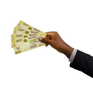 Black Hand with suit holding 3D rendered 10000 Malagasy ariary notes isolated on white background