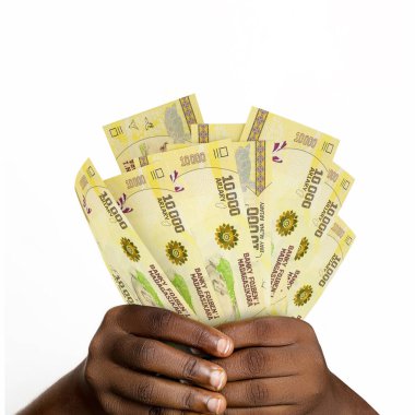 Black hands holding 3D rendered 10000 Malagasy ariary notes. closeup of Hands holding Madagascar currency notes