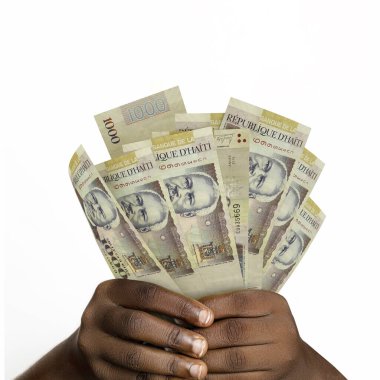 3D 'yi tutan eller 1000 tane Haiti kabağı kabağı oluşturdu. 1000 Haiti banknotunu tutan Eller 'e yakın çekim