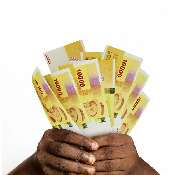 手握3D渲染科摩罗法郎钞票 持有科摩罗纸币的手的特写 — 图库照片