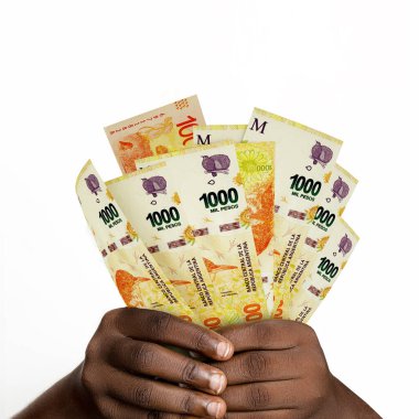 Black hands holding 3D rendered Argentine peso notes. closeup of Hands holding Argentine currency notes