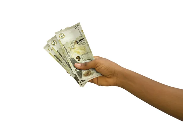Fair Hand Holding Rendered 100 Bahamian Dollar Notes Isolated White — ストック写真