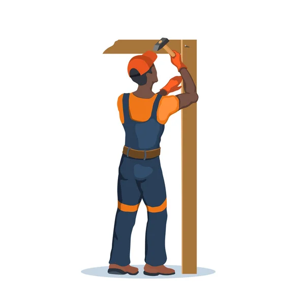 A munkások hummert használnak. Építő egy kézi szerszámmal. Egy egyenruhás férfi szöget ver. Elszigetelt ipari jelenet. Vállalkozó fiú hangszerrel — Stock Vector