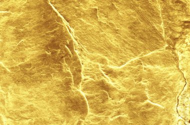 Altın renginde bir arka plan. Fotokopi alanı olan altın taş arka plan. Kaya desenli altın.