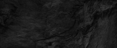 Fotokopi alanı olan koyu gri arkaplan. Taş desenli siyah grunge pankartı. Taş duvarın dokusu..