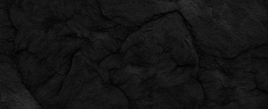 Fotokopi alanı olan koyu gri taş arka plan. Taş desenli siyah grunge pankartı. Taş duvarın dokusu..