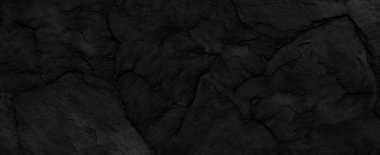 Fotokopi alanı olan koyu gri taş arka plan. Taş desenli siyah grunge pankartı. Taş duvarın dokusu..