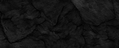 Fotokopi alanı olan koyu gri arkaplan. Taş desenli siyah grunge pankartı. Taş duvarın dokusu..