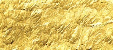Altın renginde bir arka plan. Fotokopi alanı olan altın taş arka plan. Kaya desenli altın.