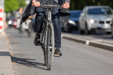 cyclist rides on a protected bike lane