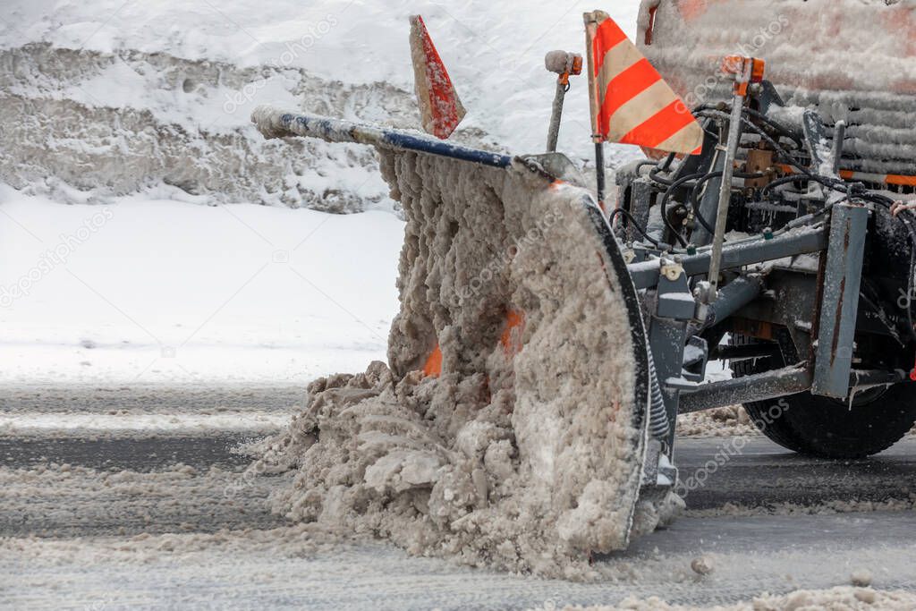 snow plow clears road in switzerland