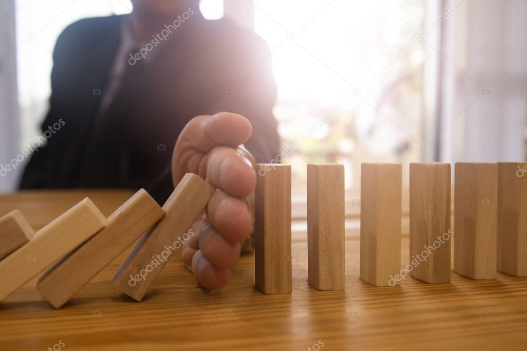 Business man gambling placing wooden block. Business concept  investment target and growth success process background present financial information planning, risk and marketing strategy analysis.