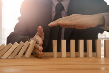 Business man gambling placing wooden block. Business concept  investment target and growth success process background present financial information planning, risk and marketing strategy analysis.