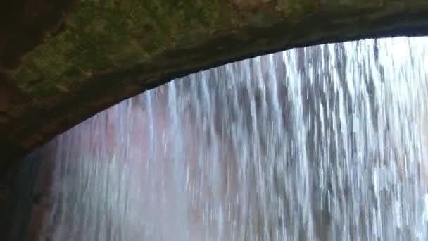 Ancient hydraulic works arch Ravine Orrido Ponte Alto in Trento view from behind waterfall - Trentino Alto Adige Region of Italy — Stock Video