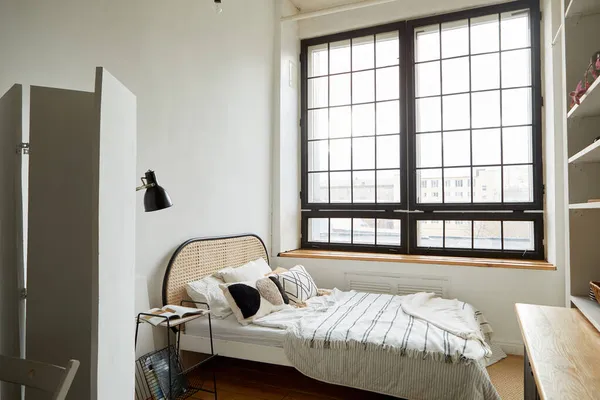 Light bedroom in modern apartment in minimal style — Stock Photo, Image