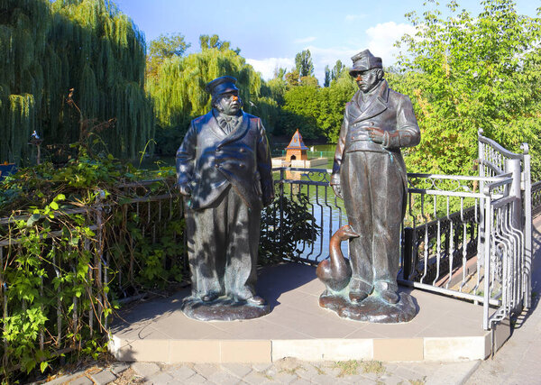 Sculptures of the literary personages of Gogol - Ivan Ivanovich and Ivan Nikiforovich near lake Mirgorodska Kalyuzha in Myrhorod, Ukraine 